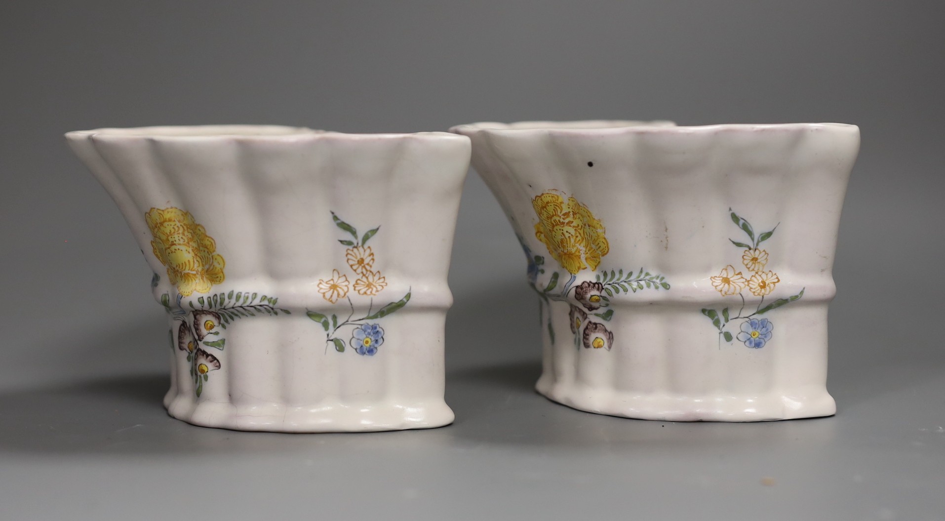 A pair of German faience flower decorated bough pots, late 18th century, 15.5cm wide